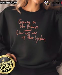 Alt Text: Official Gnawing On The Bishop's Claw sweatshirt featuring a bold design, perfect for fans of unique streetwear style.
