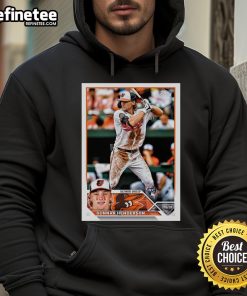 Alt Text: Official Gunnar Henderson Baltimore Orioles 2023 Topps baseball card displayed on a stylish player hoodie.