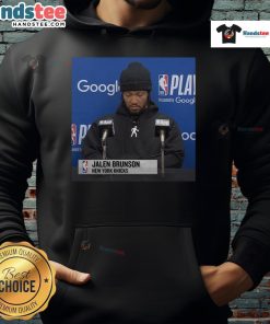 Jalen Brunson at official press conference wearing a stylish hoodie, showcasing his casual yet professional look.