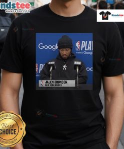 Official Jalen Brunson Press Conference T-Shirt featuring team logo and player name, perfect for fans and collectors.