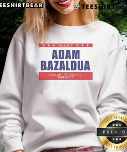 Jasmine Crockett and Adam Bazaldua wearing 'Re-elect Dallas City Council District' sweatshirt, promoting their campaign.