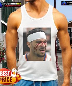 Josh Hart wearing a tank top after taking an elbow to the face during a basketball game, showcasing his determination.