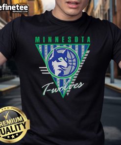 Alt Text: Official Minnesota Timberwolves Mitchell & Ness Worldwide Collection Tri-Logo T-Shirt featuring vibrant team logos.