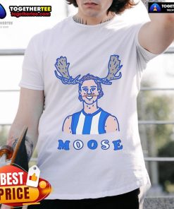 Official Moosebar Tcd T-Shirt displayed on a wooden background, showcasing its unique design and vibrant colors.