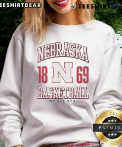 Alt Text: Official Nebraska Cornhuskers basketball sweatshirt featuring the team logo, perfect for fans and warm-ups.