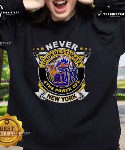 Alt Text: Official Never Underestimate The Power Of New York Sports Sweatshirt in navy blue with bold graphic design.