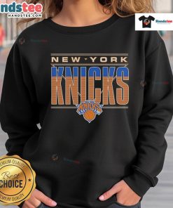 Official New York Knicks striped sweatshirt featuring team colors and logo, perfect for fans and casual wear.