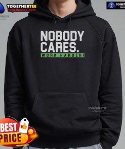Alt Text: Official Nobody Cares Work Harder Hoodie in black, featuring bold white text for motivational style.