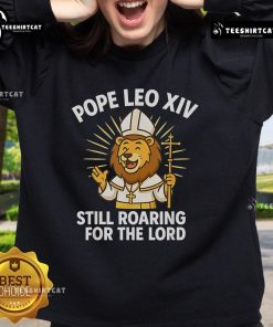 Official Pope Leo XIV 'Still Roaring For The Lord' Lion Sweatshirt featuring a bold lion graphic and inspirational design.