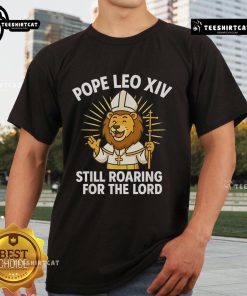 Official Pope Leo XIV Still Roaring For The Lord Lion T-Shirt featuring a bold lion design and inspirational message.