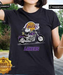 Alt Text: Snoopy and Woodstock riding a motorbike in a fun design on a Los Angeles Lakers ladies tee shirt.