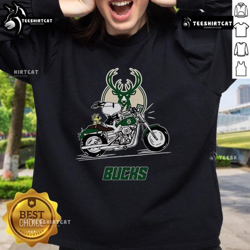 Alt Text: Snoopy and Woodstock riding a motorbike on a Milwaukee Bucks sweatshirt, showcasing a fun and vibrant design.