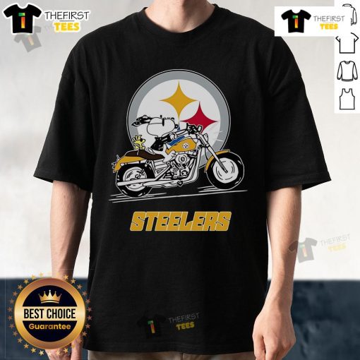 Official Snoopy and Woodstock driving a motorbike on a Pittsburgh Steelers T-shirt, perfect for NFL fans.