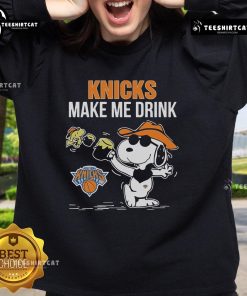 Alt Text: Official Snoopy and Woodstock New York Knicks Make Me Drink sweatshirt featuring vibrant graphics and cozy design.