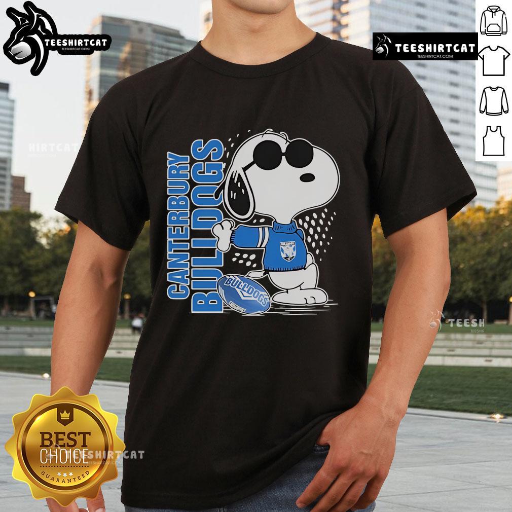 Official Snoopy Fan Canterbury Bankstown Bulldogs X The Peanuts T Shirt Alt Text: Official Snoopy Fan Canterbury-Bankstown Bulldogs X The Peanuts T-Shirt featuring Snoopy and Bulldogs logo design.