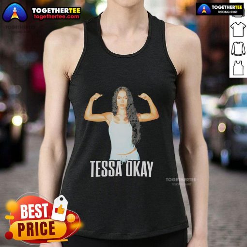 Alt Text: Tessa in a stylish tank top showcasing her muscles and fitness, embodying strength and confidence.