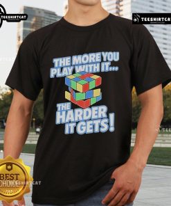 Alt Text: Official The More You Play With It The Harder It Gets Rubix Cube T-Shirt featuring a colorful cube graphic.
