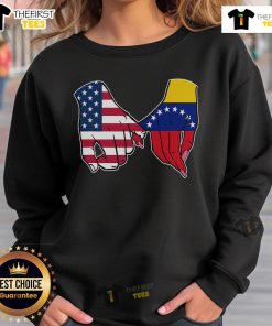 Alt Text: Official USA and Venezuela flags hands together sweatshirt showcasing unity and cultural pride.