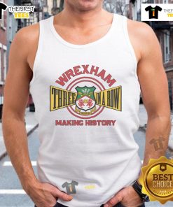 Alt Text: Official Wrexham AFC Three in a Row tank top celebrating the team's historic achievements in football.