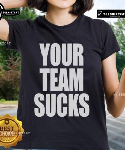Official Your Team Sucks Ladies Tee featuring bold graphics and a stylish design for sports fans and casual wear.