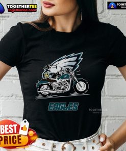 Original Snoopy and Woodstock riding a motorbike on a Philadelphia Eagles ladies tee, perfect for fans and collectors.