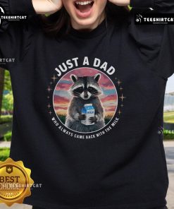 Cute raccoon wearing 'Just Dad Who Always Came Back With Milk' sweatshirt, perfect for animal lovers and cozy fashion.