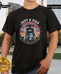Pretty raccoon wearing 'Just Dad Who Always Came Back With Milk' T-shirt, showcasing a playful and whimsical design.