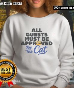 Cozy 'Top All Guests Must Be Approved By The Cat' sweatshirt featuring playful cat graphics, perfect for cat lovers.