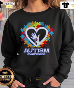 Cozy sweatshirt featuring a heart-shaped puzzle design symbolizing Autism Awareness and support for the autism community.