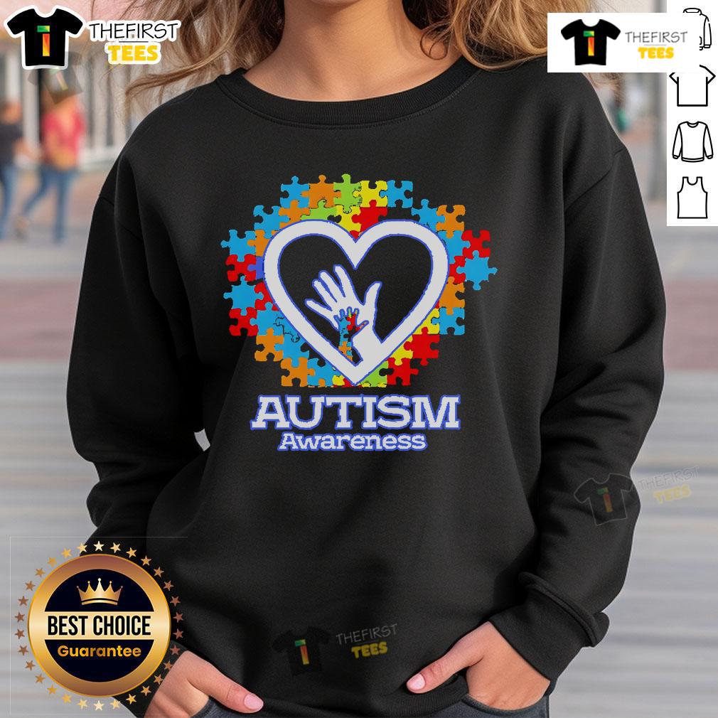 Top Autism Awareness Hands Puzzle Heart Sweatshirt Cozy sweatshirt featuring a heart-shaped puzzle design symbolizing Autism Awareness and support for the autism community.