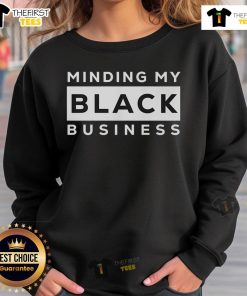 Stylish black sweatshirt with 'Minding My Black Business' text, perfect for casual wear and expressing pride.