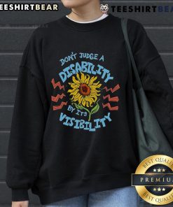 Sunflower sweatshirt with the message 'Don't Judge A Disability By Its Visibility' promoting disability awareness.
