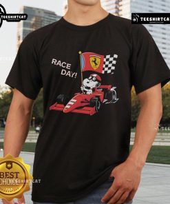 Alt Text: Top Ferrari Snoopy F1 Race Day T-Shirt featuring Snoopy in a Ferrari racing outfit on a vibrant red background.