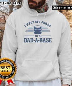 Man wearing a 'Top I Keep My Jokes In A Dad A Base' hoodie, showcasing a fun dad humor style in casual wear.