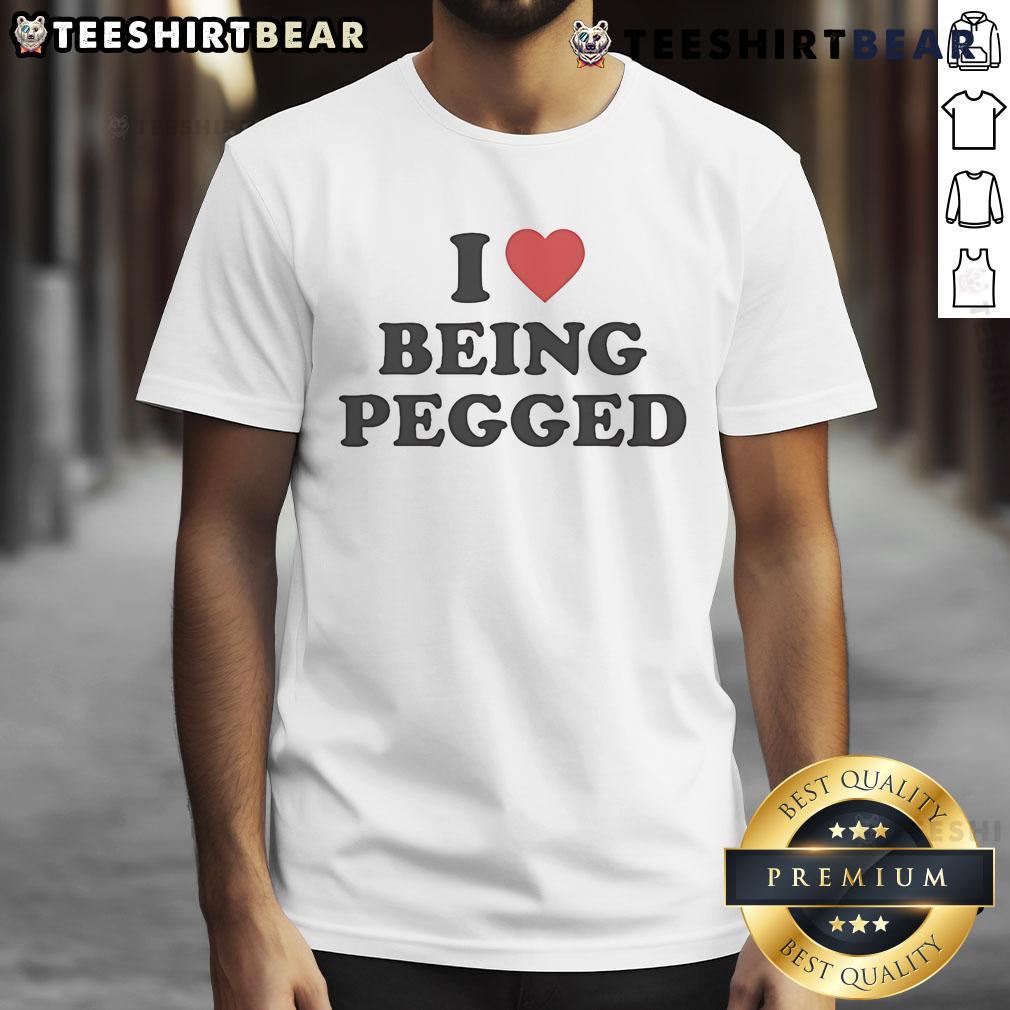 Top I Love Being Pegged T Shirt Top I Love Being Pegged T-Shirt featuring a playful design, perfect for expressing fun and confidence in style.