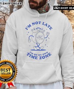 Cozy hoodie featuring 'I'm Not Late, I'm On My Own Time Zone' design, perfect for casual wear and expressing individuality.