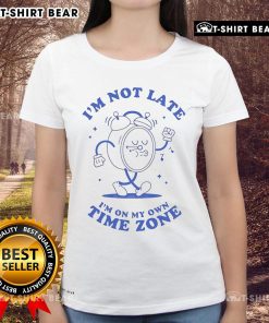 Alt Text: Stylish 'I'm Not Late, Just on My Own Time Zone' ladies tee featuring a fun clock design, perfect for casual wear.