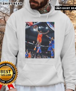 Top Jalen Williams flying score in black game frames, showcasing Oklahoma hoodie style and athleticism on the court.