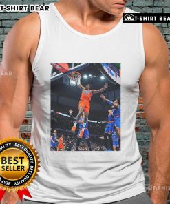 Jalen Williams soaring for a score in a black tank top during an Oklahoma game, showcasing athleticism and style.