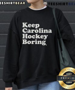 Top Keep Carolina Hockey Boring Sweatshirt featuring bold text and a stylish design, perfect for hockey fans.
