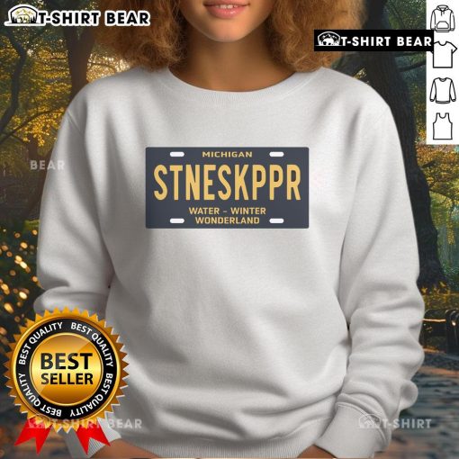 Cozy sweatshirt featuring the 'Top Michigan Stoneskipper Water Winter Wonderland' license plate design, perfect for winter wear.