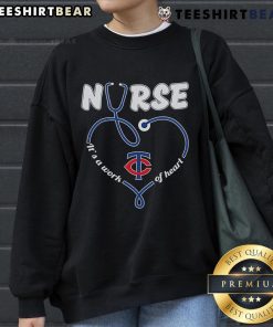 Cozy Minnesota Twins sweatshirt featuring 'It's a Work of Heart' design, perfect for fans and nurses alike.