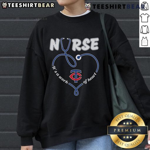Cozy Minnesota Twins sweatshirt featuring 'It's a Work of Heart' design, perfect for fans and nurses alike.