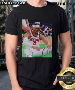 Josh Hart wearing a T-shirt after getting elbowed in the face, showcasing resilience and humor in a sports moment.