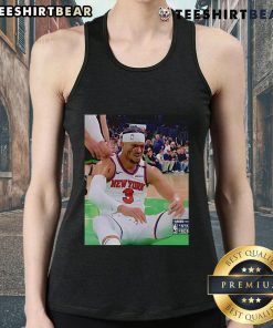 Josh Hart grimacing after getting elbowed in the face while wearing a tank top, showcasing the intensity of the game.