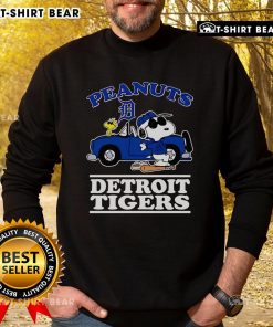 Top Snoopy and Woodstock Peanuts Detroit Tigers sweatshirt featuring classic cartoon characters and team logo.