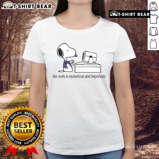Alt Text: Top Snoopy The Work Is Mysterious And Important Ladies Tee featuring a playful Snoopy graphic on a stylish women's shirt.