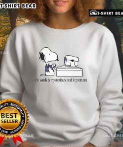 Cozy Snoopy sweatshirt featuring 'The Work Is Mysterious and Important' design, perfect for fans of Peanuts and comfy fashion.