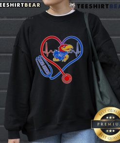 Alt Text: Kansas Jayhawks sweatshirt featuring a stethoscope and heart design, perfect for healthcare fans and alumni.
