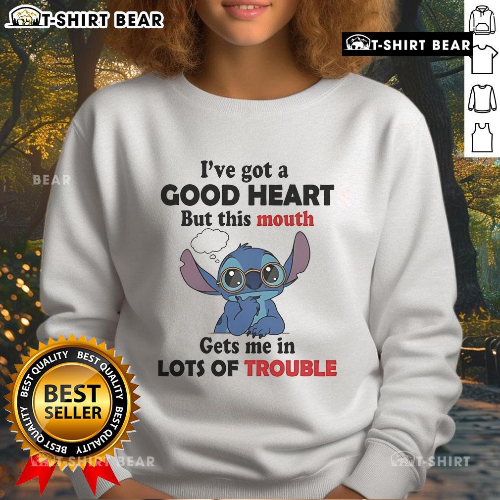 Top Stitch I've Got A Good Heart But This Mouth Gets Me In Lots Of Trouble Sweatshirt Alt Text: Cozy 'I've Got A Good Heart But This Mouth Gets Me In Lots Of Trouble' sweatshirt, perfect for casual wear and making a statement.